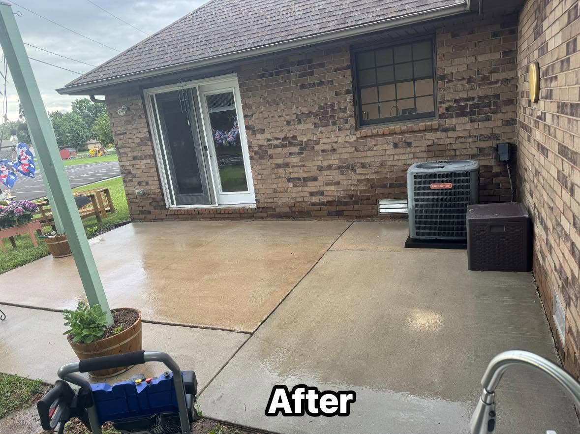 The same concrete patio clean and bright after pressure washing