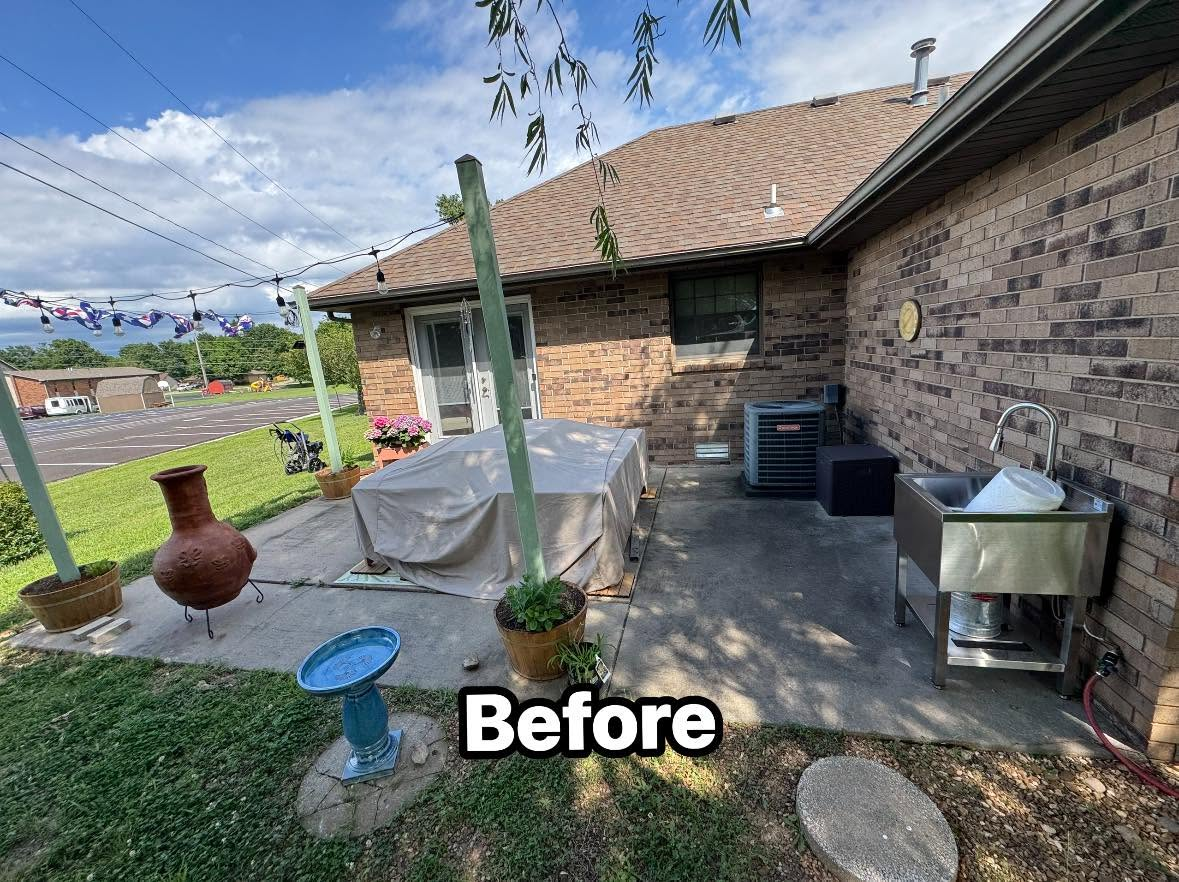 Concrete patio covered in dirt and mildew before pressure washing